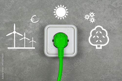 grüner Stecker in Steckdose Energiewende