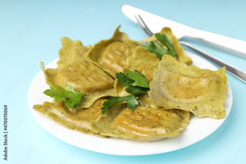 Delicious food concept with ravioli on blue background Delicious food concept with ravioli on blue background