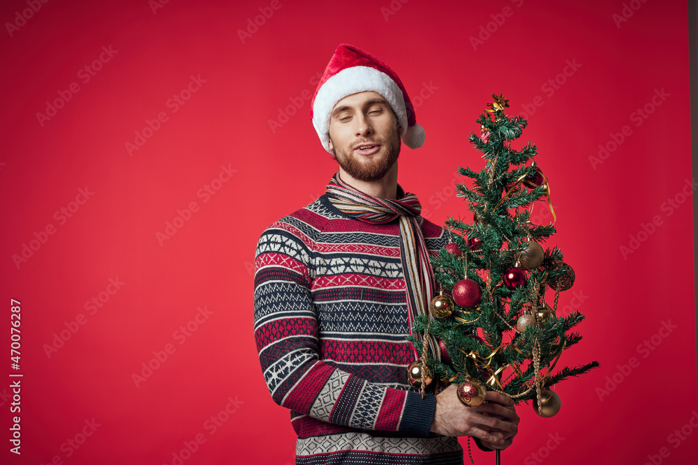 emotional man in New Year's clothes decoration christmas studio posing emotional man in New Year's clothes decoration christmas studio posing
