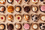 Selection of many cupcakes with decoration from above
