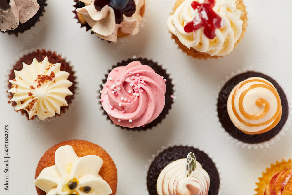Lots of colorful little different cupcakes from above Lots of colorful little different cupcakes from above