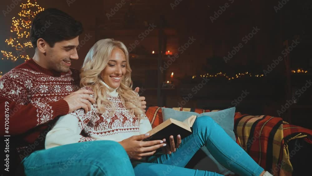 Lady guy sit sofa read diary newyear tree print pullover room illuminated Lady guy sit sofa read diary newyear tree print pullover room illuminated