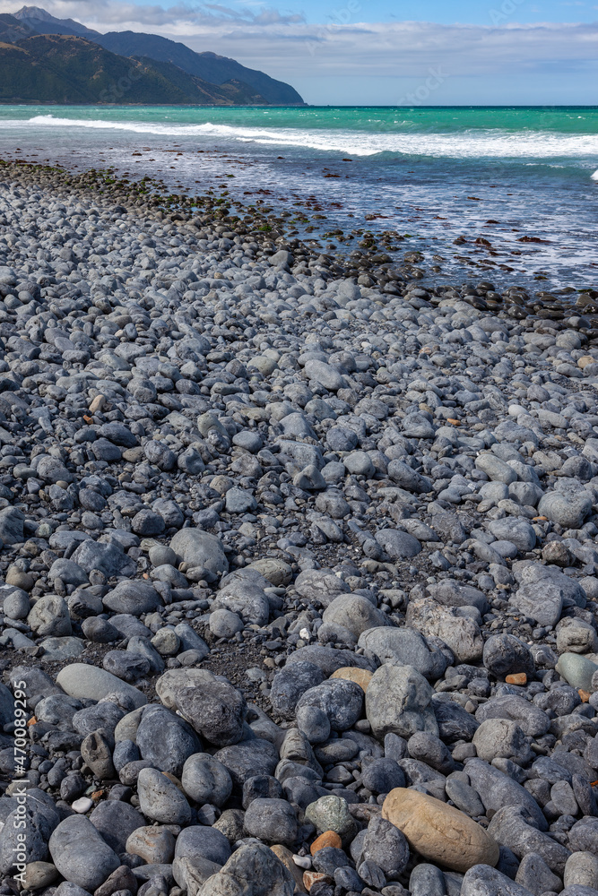 Beach near Mangamaunu strewn with small grey boulders Beach near Mangamaunu strewn with small grey boulders