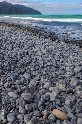 Beach near Mangamaunu strewn with small grey boulders