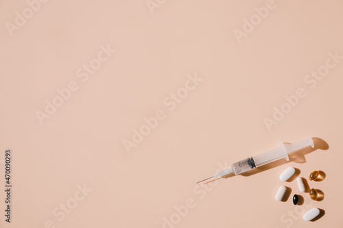Syringes and pills that have medicine in them.
