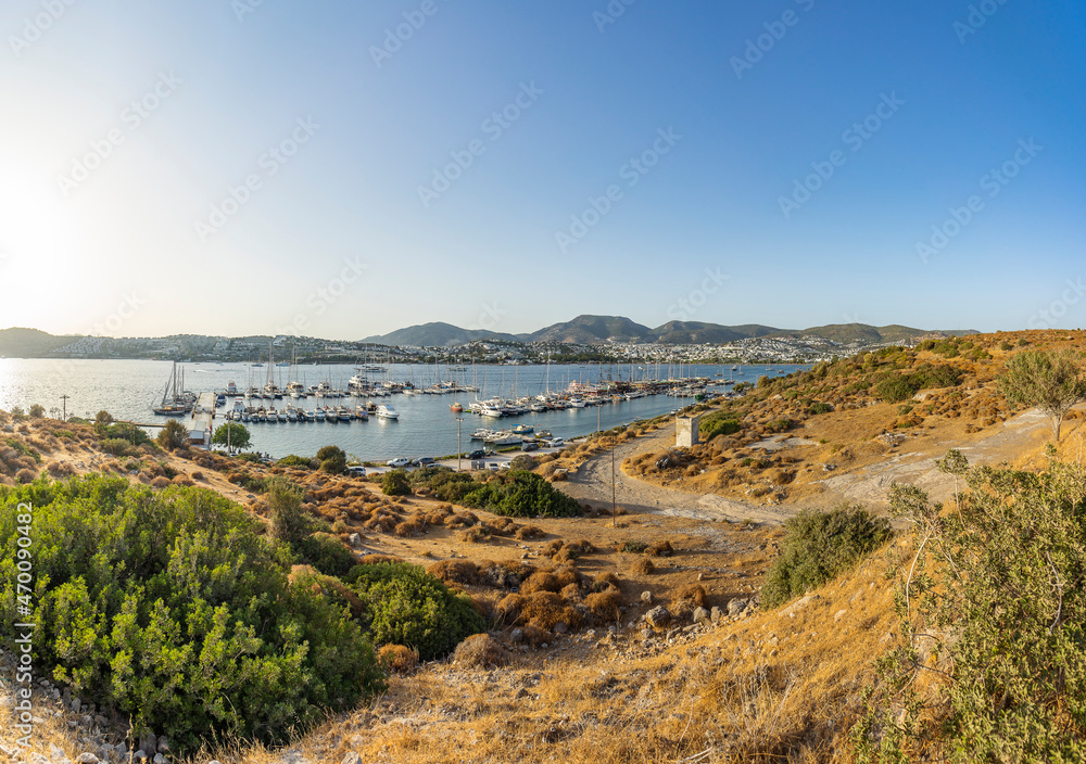 A magnificent landscape with a view of the mooring of sailing boats in the bay.