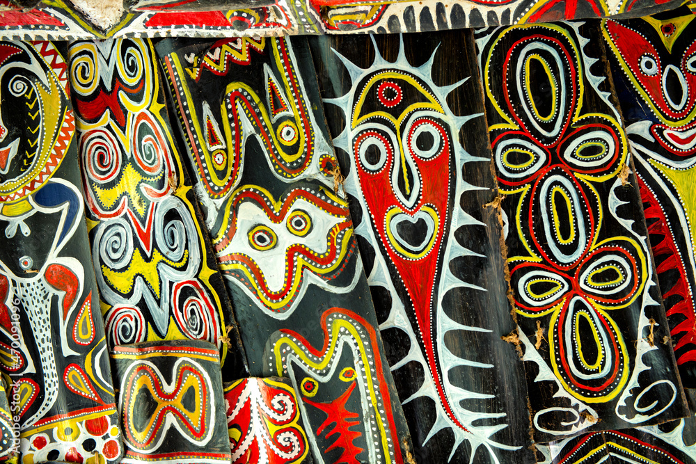Colorful paintings/mask in a spirit house in the Sepik area in Papua New Guinea Colorful paintings/mask in a spirit house in the Sepik area in Papua New Guinea