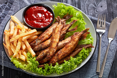 crispy fried capelin with lettuce, french fries