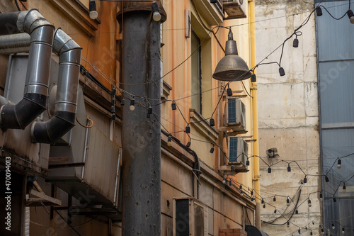 Lamp garlands hanging on old street