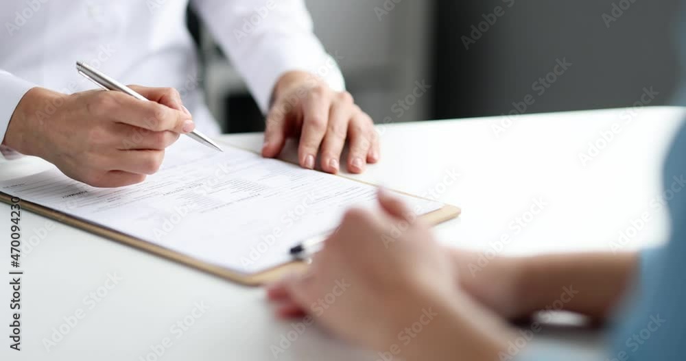 Doctor fills out patient medical record slow motion 4k movie Doctor fills out patient medical record slow motion 4k movie