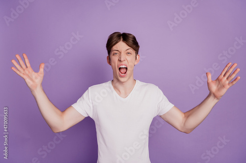 Photo of young man unhappy bad negative shout angry mad conflict isolated over violet color background