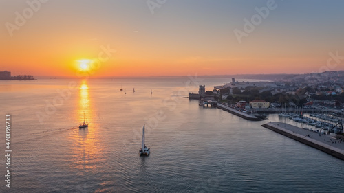 Aerial view of the Portuguese Historical Folk Patrimony, Belem Tower, on the Tagus River. During sunset. photo
