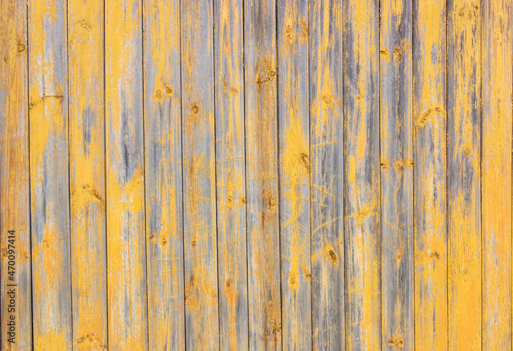 Old grey and yellow wooden background with cracks and scratches in vintage style Old grey and yellow wooden background with cracks and scratches in vintage style
