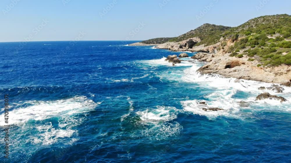 Blue Ocean With Foamy Waves Crashing On Coastal Cliffs - Jerusalem Beach In Erisos, Greece - aerial drone shot Blue Ocean With Foamy Waves Crashing On Coastal Cliffs - Jerusalem Beach In Erisos, Greece - aerial drone shot