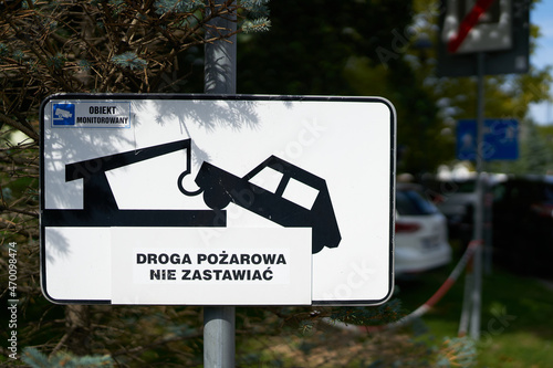 Sign at an access road to a parking lot in Kolobrzeg in Poland with the inscription Parking on the road prohibited (Droga Pozarowa nie Zastawiac) photo
