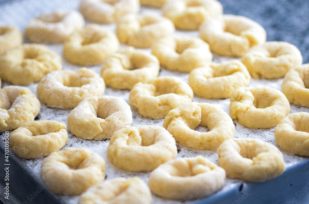 Detail of homemade pastry made with flour, sugar and lemon, about to be baked