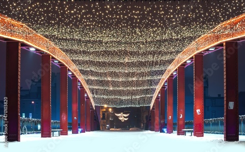 Bridge at the Ostrow Tumski decorated with illuminated Christmas ornaments in Poznan, Poland photo