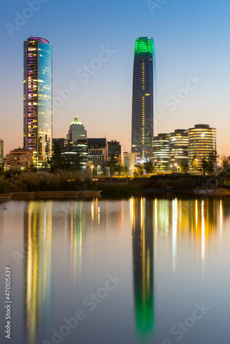 Pond at Bicentennial Park in the wealthy Vitacura district and skyline of buildings at financial district  Santiago de Chile