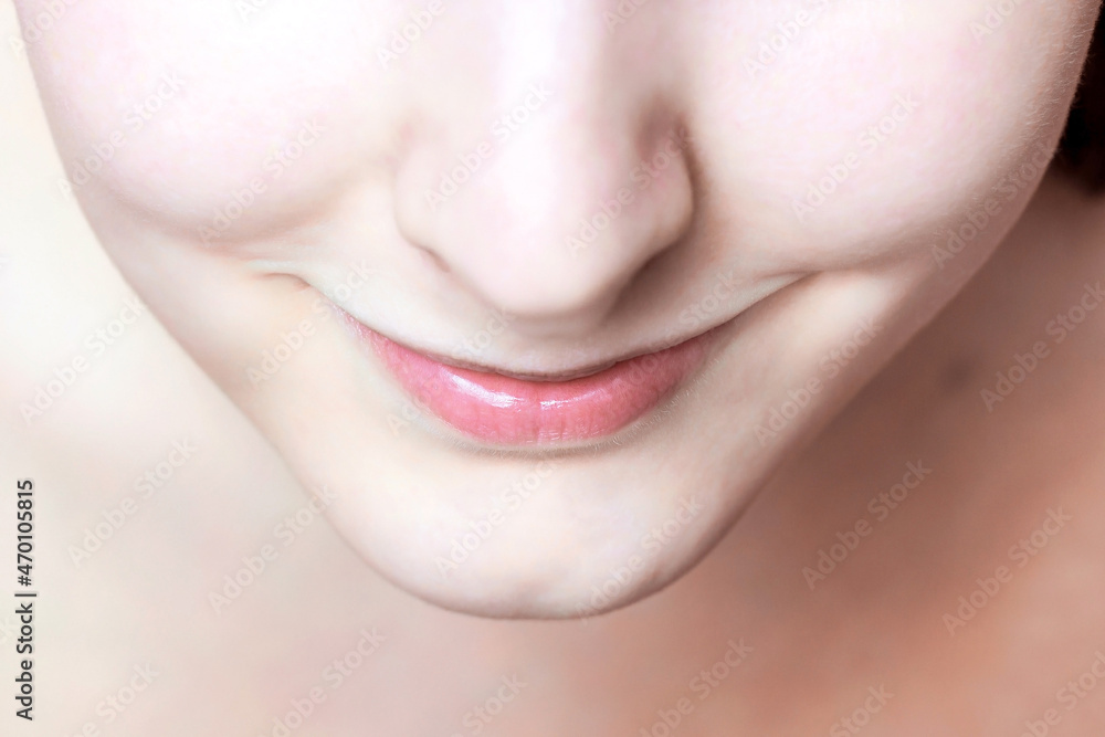 Obraz premium Young caucasian woman smiling face with clean skin and lips. Spa, skincare, cosmetics using and make up concept.