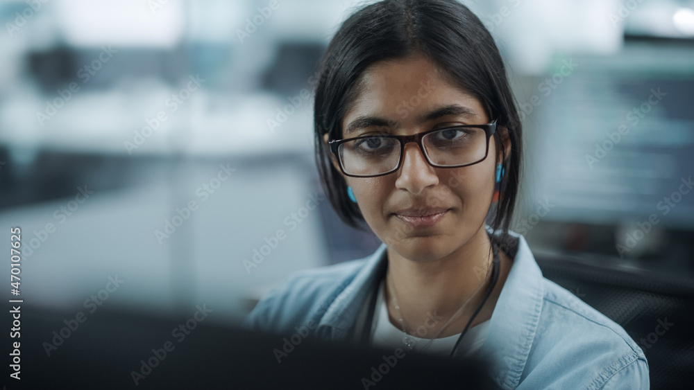 Diverse Office: Portrait of Empowered Indian IT Programmer Working on Desktop Computer. Female Specialist Wearing Glasses Create Innovative Software. Professional Engineer Develop Inspirational App Diverse Office: Portrait of Empowered Indian IT Programmer Working on Desktop Computer. Female Specialist Wearing Glasses Create Innovative Software. Professional Engineer Develop Inspirational App