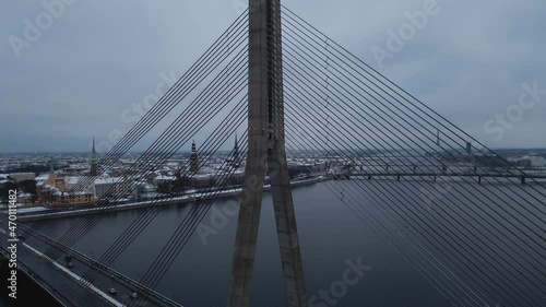 Aerial revealing shot of vansu bridge with car traffic during winter photo