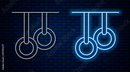 Glowing neon line Gymnastic rings icon isolated on brick wall background. Playground equipment with hanging rope with rings. Vector