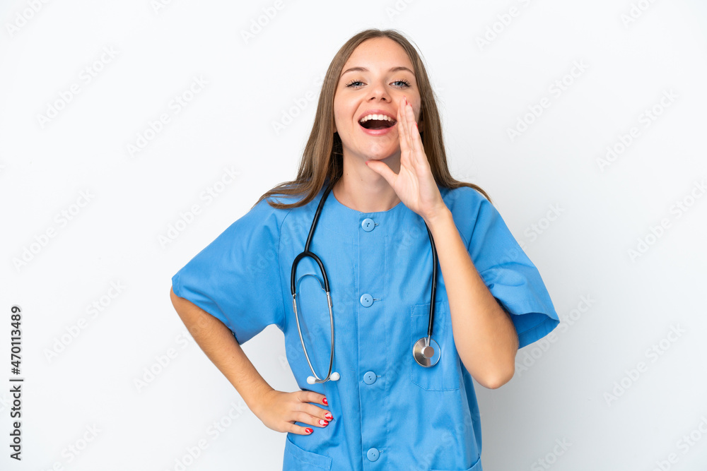 Young surgeon doctor Lithuanian woman isolated on white background shouting with mouth wide open Young surgeon doctor Lithuanian woman isolated on white background shouting with mouth wide open