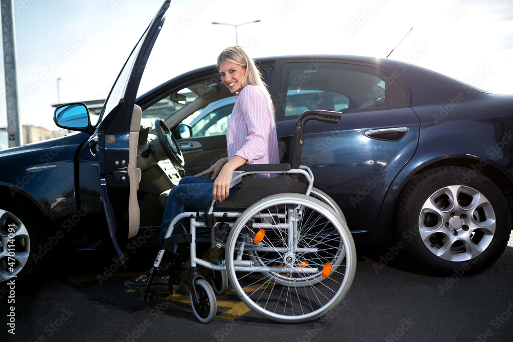 Disabled woman making a safe approach to her automobile Disabled woman making a safe approach to her automobile