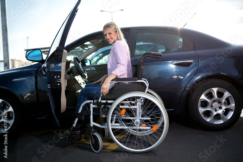Disabled woman making a safe approach to her automobile © didesign