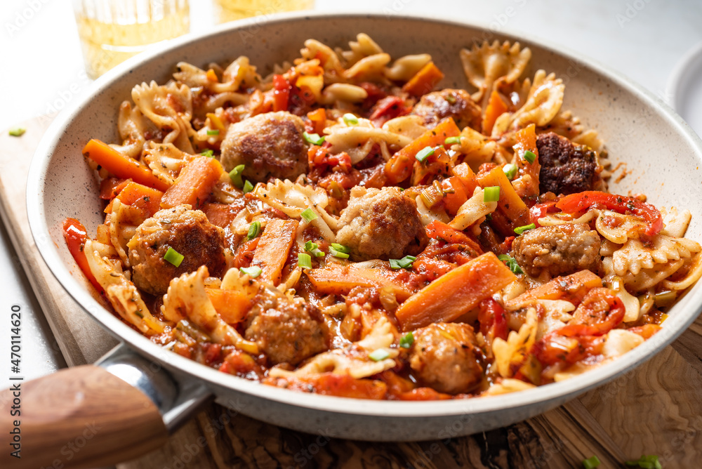 One pan dish. Pasta with onion, red pepper, garlic, tomatoes, carrot and meatballs. One pan dish. Pasta with onion, red pepper, garlic, tomatoes, carrot and meatballs.