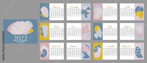 Abstract calendar for 2022 in horizontal A5 format. Week starts on Monday.  Calendar for 2022 by months with cover, with trending color spots and line plants, gold gradient text.