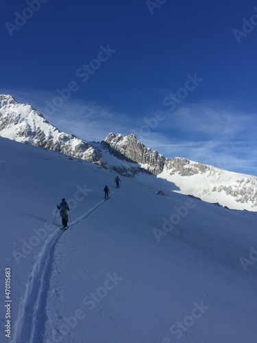 three men are on a ski tour in the German Alps