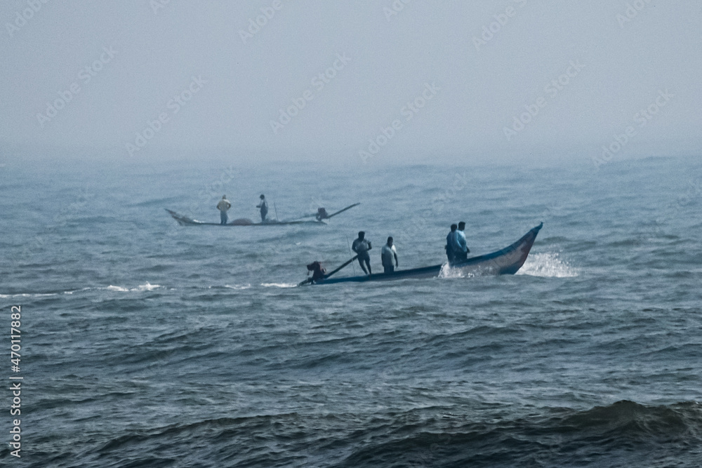 Naklejka premium boat in the sea, fishermen in boat, sea, morning sea, morning fishing 