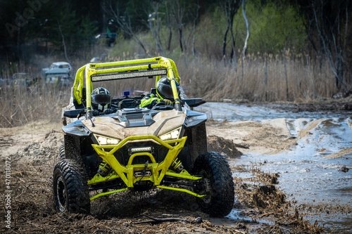ATV and UTV offroad vehicle racing in hard track with mud splash. Extreme, adrenalin. 4x4. photo