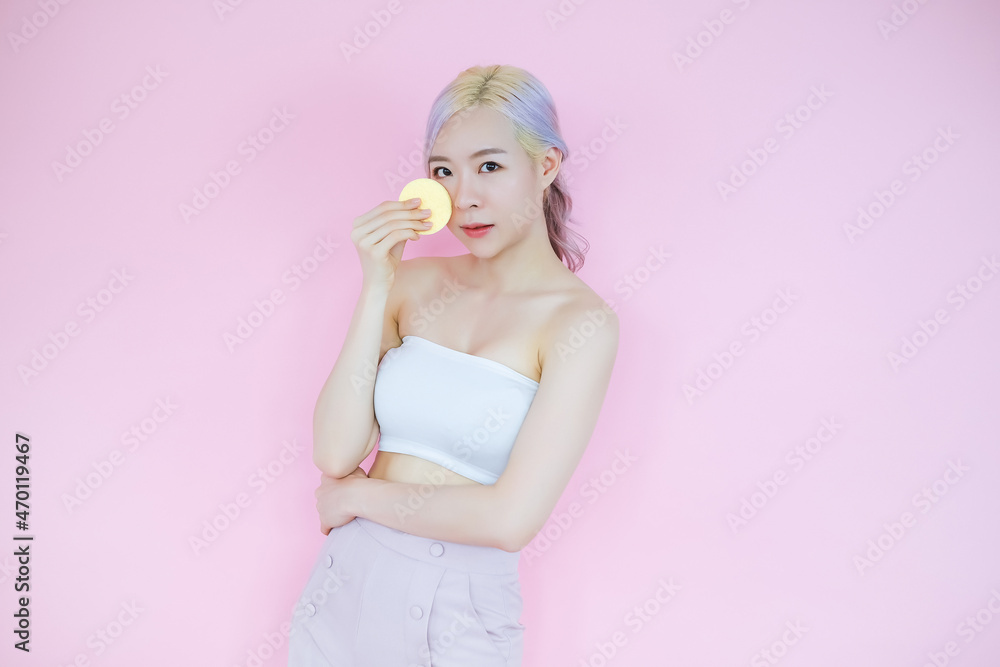 posing beautiful asia woman posing on pink background, emotions action, beauty concept and hair highlights with blush brush posing beautiful asia woman posing on pink background, emotions action, beauty concept and hair highlights with blush brush