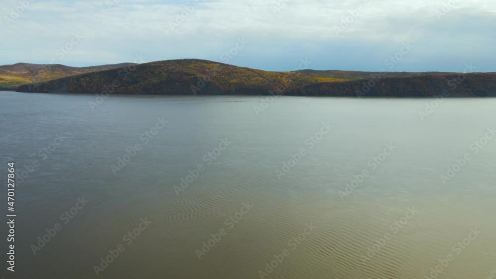 Aerial view of Mountain Ridge With Forest near to River in Gold Autumn, Russia, Komsomolsk-on-Amure, Amure River Aerial view of Mountain Ridge With Forest near to River in Gold Autumn, Russia, Komsomolsk-on-Amure, Amure River