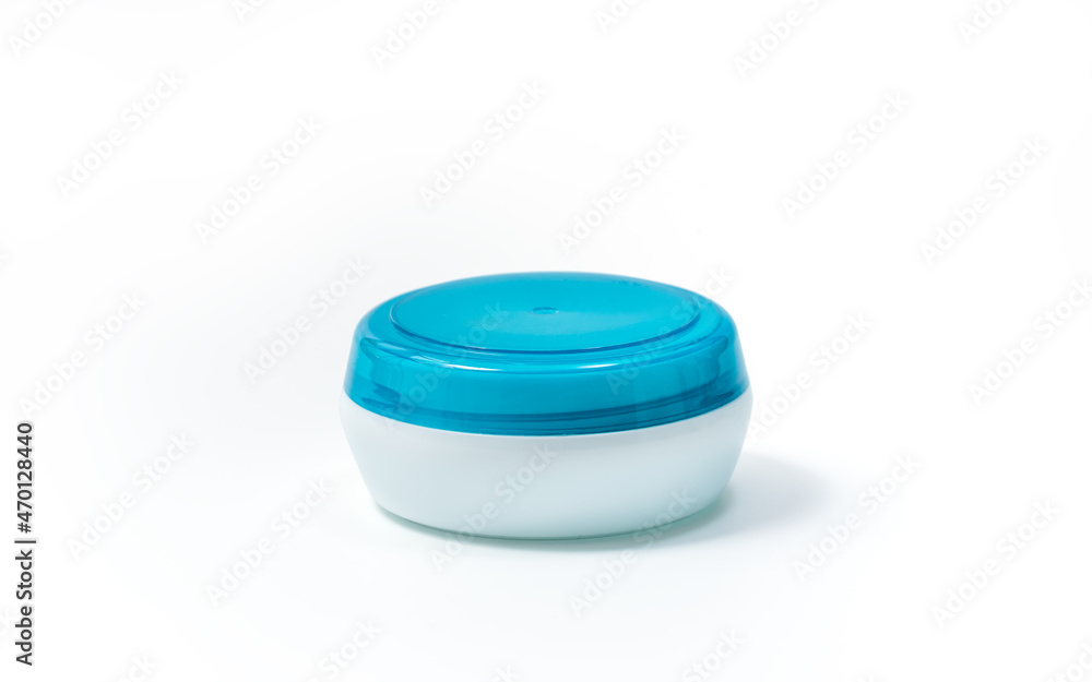 Empty White Plastic opaque cream jar with blue translucent lid. Isolated on white background. Cosmetic product for skin care, Clipping path included Empty White Plastic opaque cream jar with blue translucent lid. Isolated on white background. Cosmetic product for skin care, Clipping path included