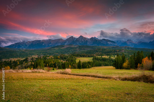 A beautiful sunset over the Tatra Mountains . The pass over Lapszanka in Poland.