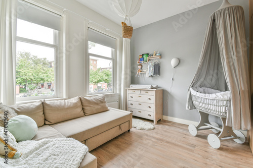 Living room with couch and cradle photo