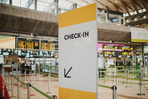 Check in signboard in airport photo