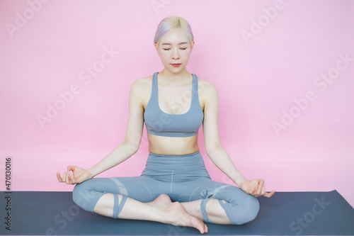 beautiful asia woman on pink background, fitness sports and recreation concept