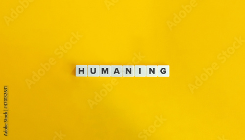 Humaning Word, Marketing Approach and Banner. Block letters on bright orange background. Minimal aesthetics.