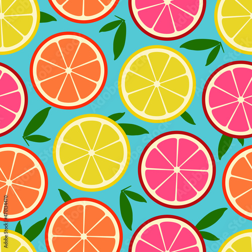 Seamless vector pattern with citruses slices: oranges, lemons and grapefruits on blue background