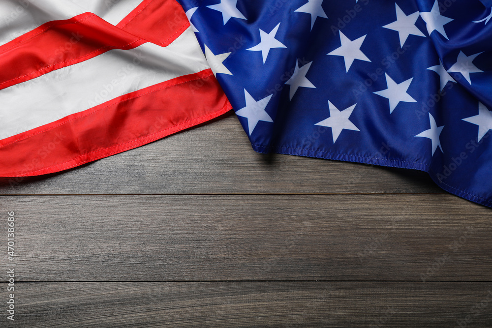 Fototapeta premium American flag on wooden table, top view. Space for text