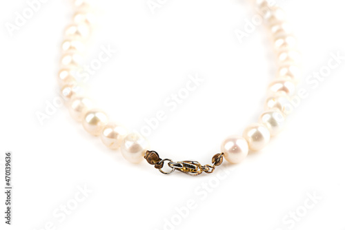 Selective focus on the lock of a pearl bead necklace.