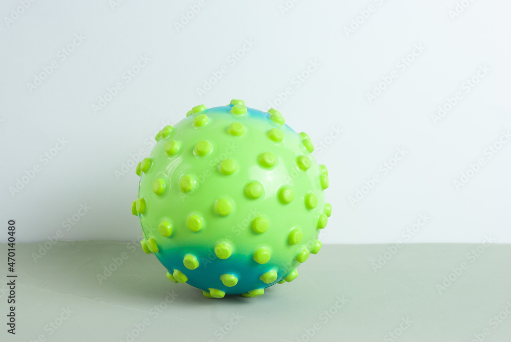 Childrens ball in the form of a virus on a gray background Childrens ball in the form of a virus on a gray background