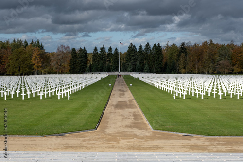 Neupre, Belgium - November 1, 2021: Ardennes American Cemetery and Memorial. Many of the burial are from the Ardennes winter offensive (Battle of the Bulge). Autumn sunny day. Selective focus. photo