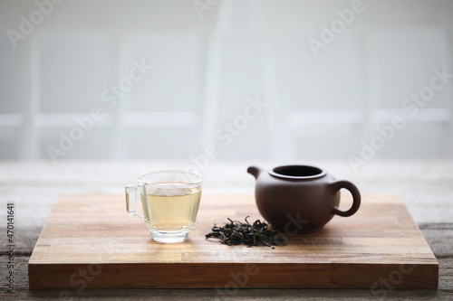 Glass tea cup and clay tea pot