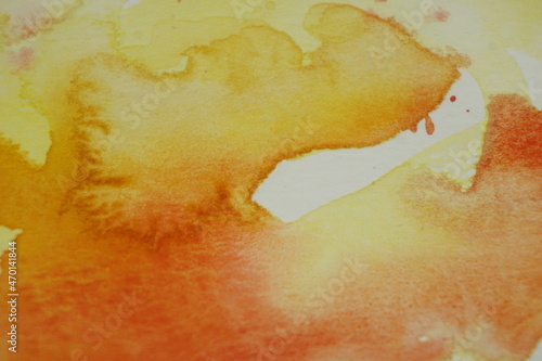 Abstract yellow and orange watercolour background.