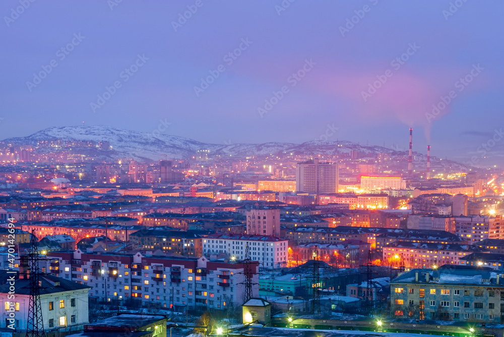 Murmansk city in winter is the northern port city. The largest behind the Arctic Circle. Evening city against the backdrop of sunset skies.